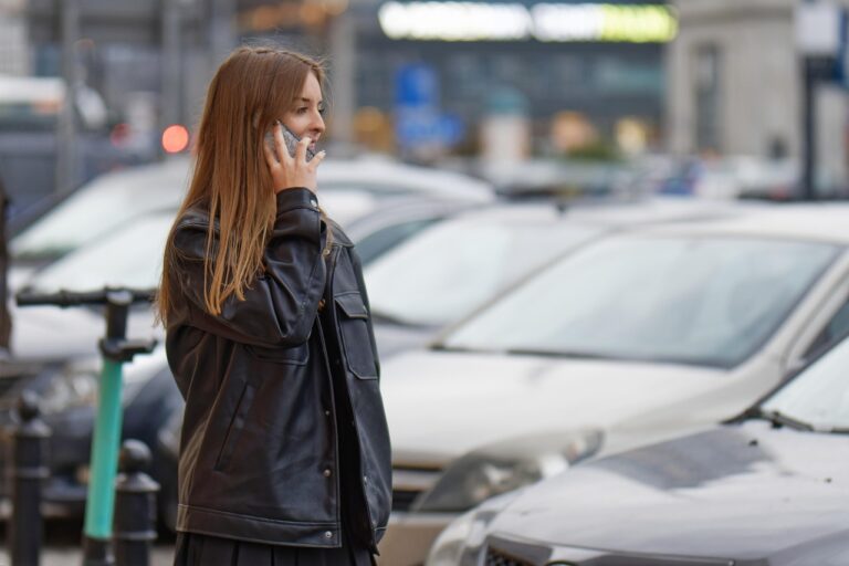 Mobile Plans That Include Calls and Texts to Mexico and Canada Woman making a phone call while standing outdoors in a street