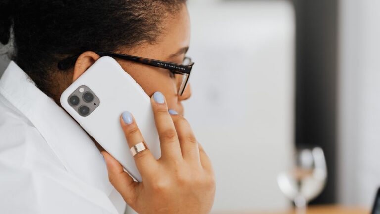 The Plans That Put International Minutes In With the Data Woman holding a phone to her ear while sitting at a cafe table
