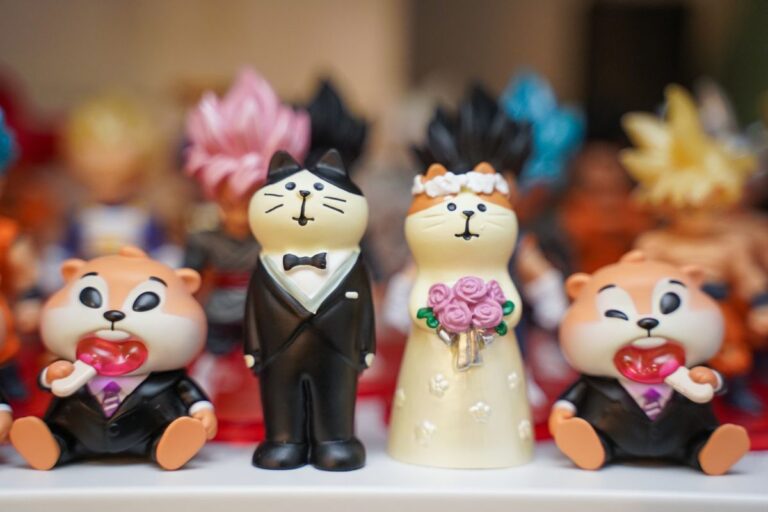 Small collectible figurines displayed together on a shelf