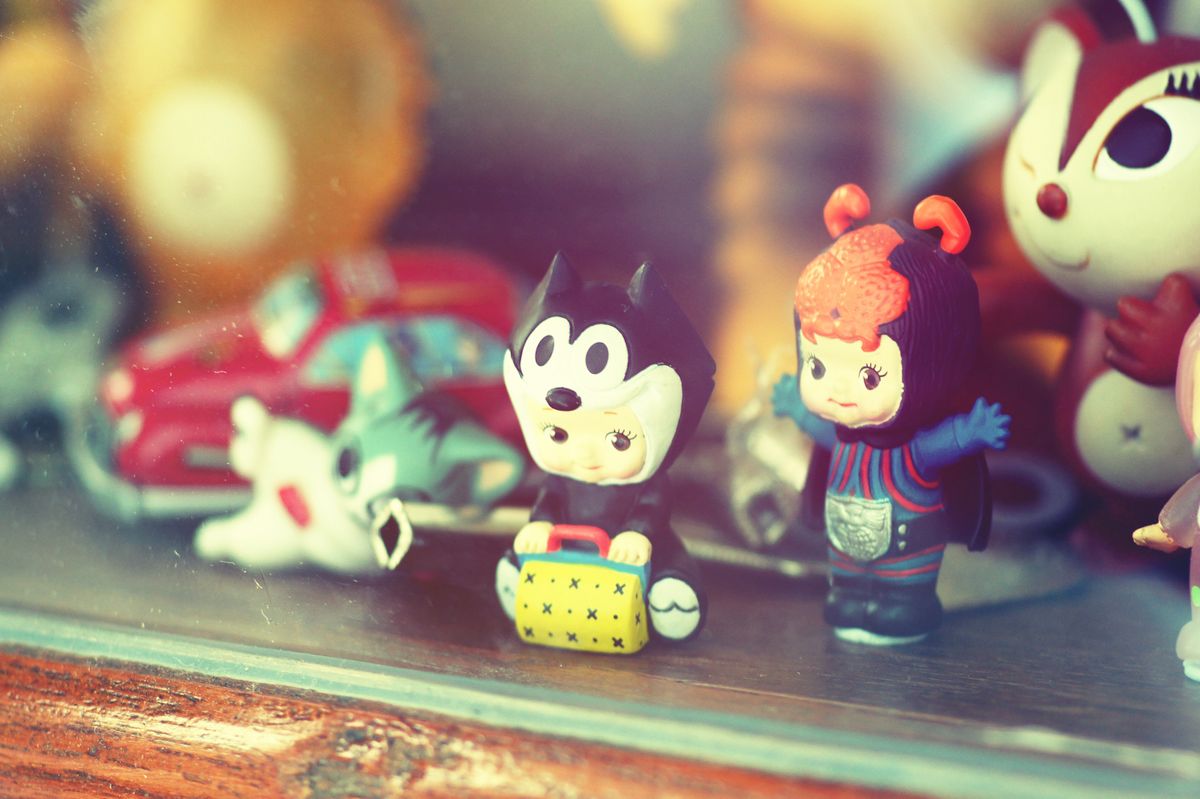 Small vinyl collectible figures arranged in a display case