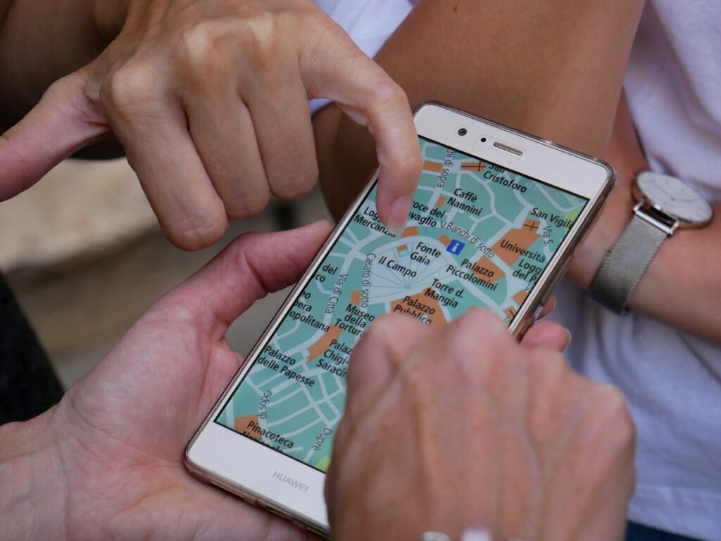 The Roaming Bundles That Cover Europe and the Balkans Two travellers looking at a map of an Italian city on a phone