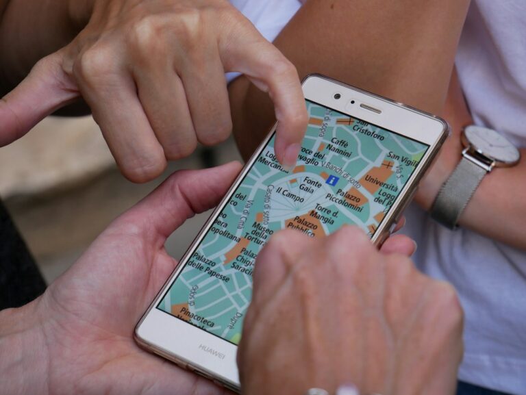 The Roaming Bundles That Cover Europe and the Balkans Two travellers looking at a map of an Italian city on a phone