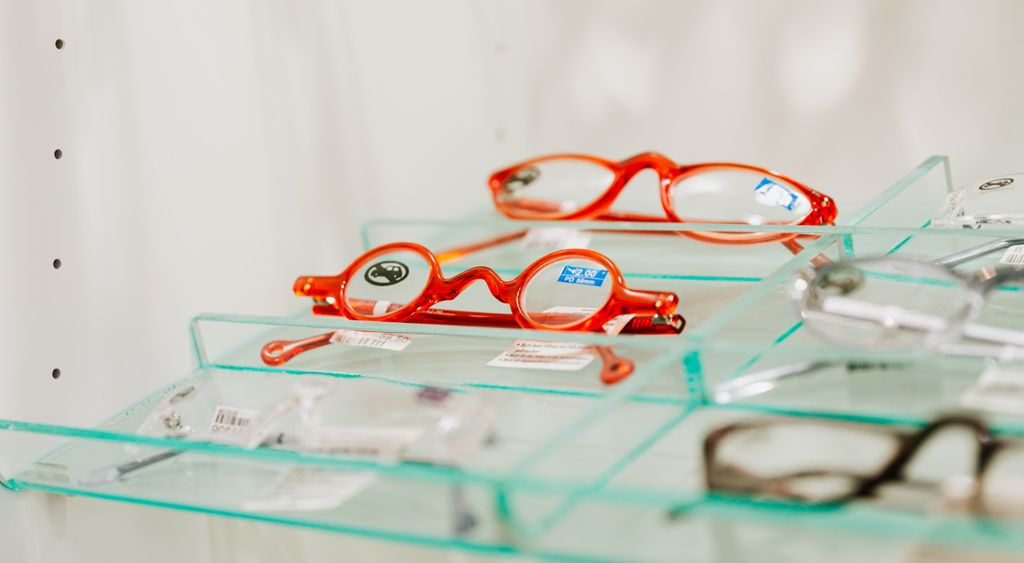 Eyeglass frames arranged on a glass display stand