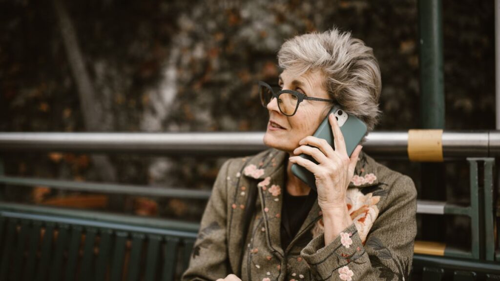 Phone Plans and Home Services With Member Discounts Older woman taking a call on a smartphone outdoors