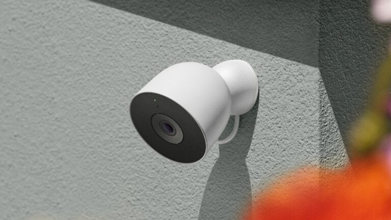 Security Cameras and Video Doorbells That Let You Watch Home from Anywhere Outdoor security camera mounted on a textured exterior wall
