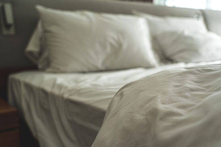 A bed made up with a soft green brushed-cotton duvet set