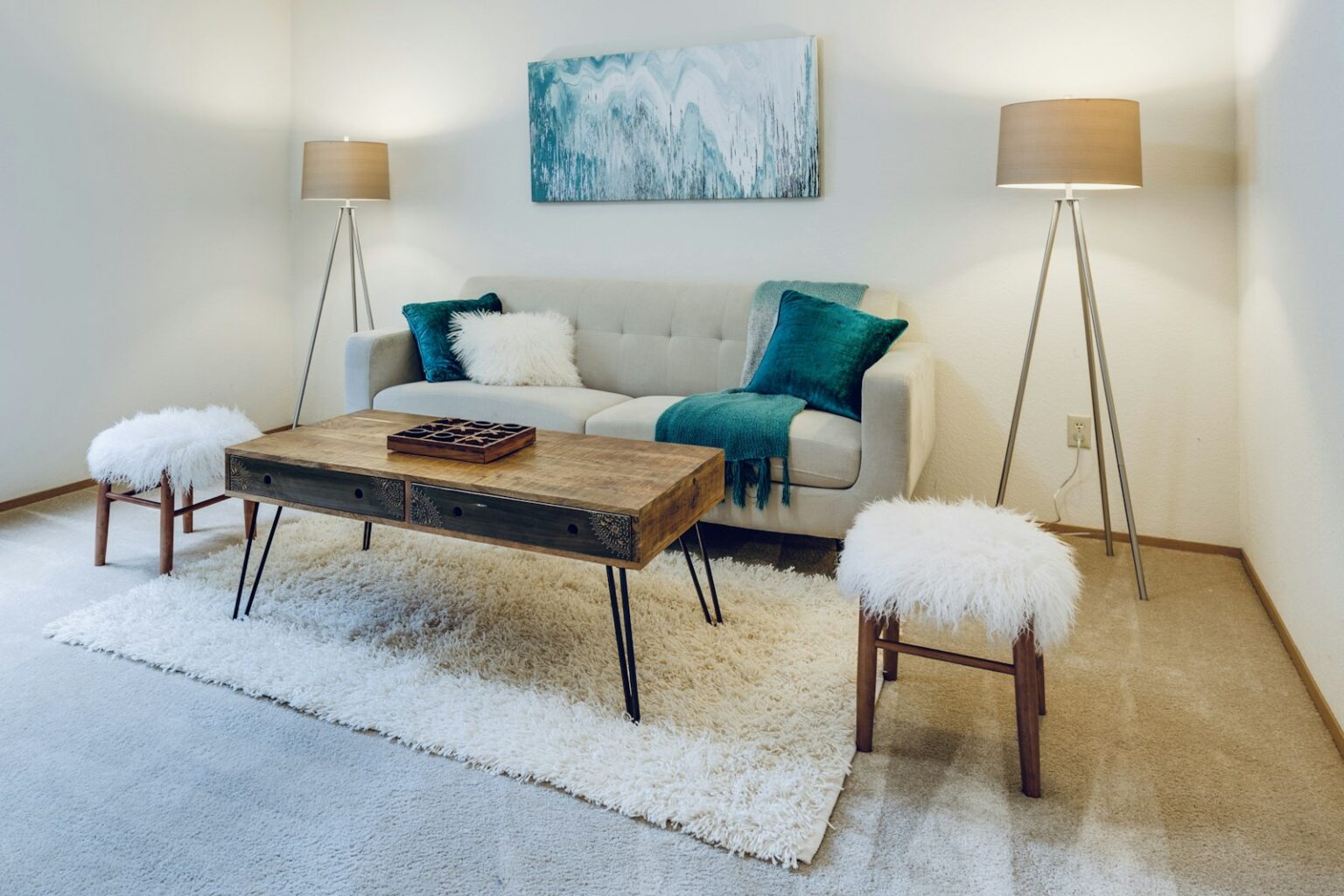 Rugs That Suit a Busy Household and Still Look Good A living room with a pale rug under a low coffee table