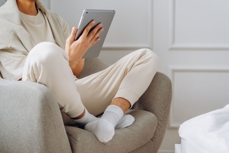 Complete Magazine Bundles Included With a News Subscription Reader relaxing in an armchair with a tablet